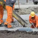 Five men working at a construction site.