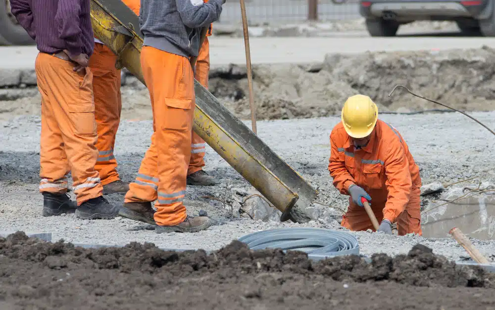 Five men working at a construction site.